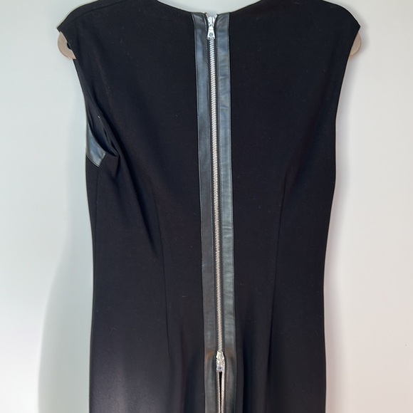 New Cache black stylish below the knee dress. Leather accents,zipper down back. - Picture 7 of 7